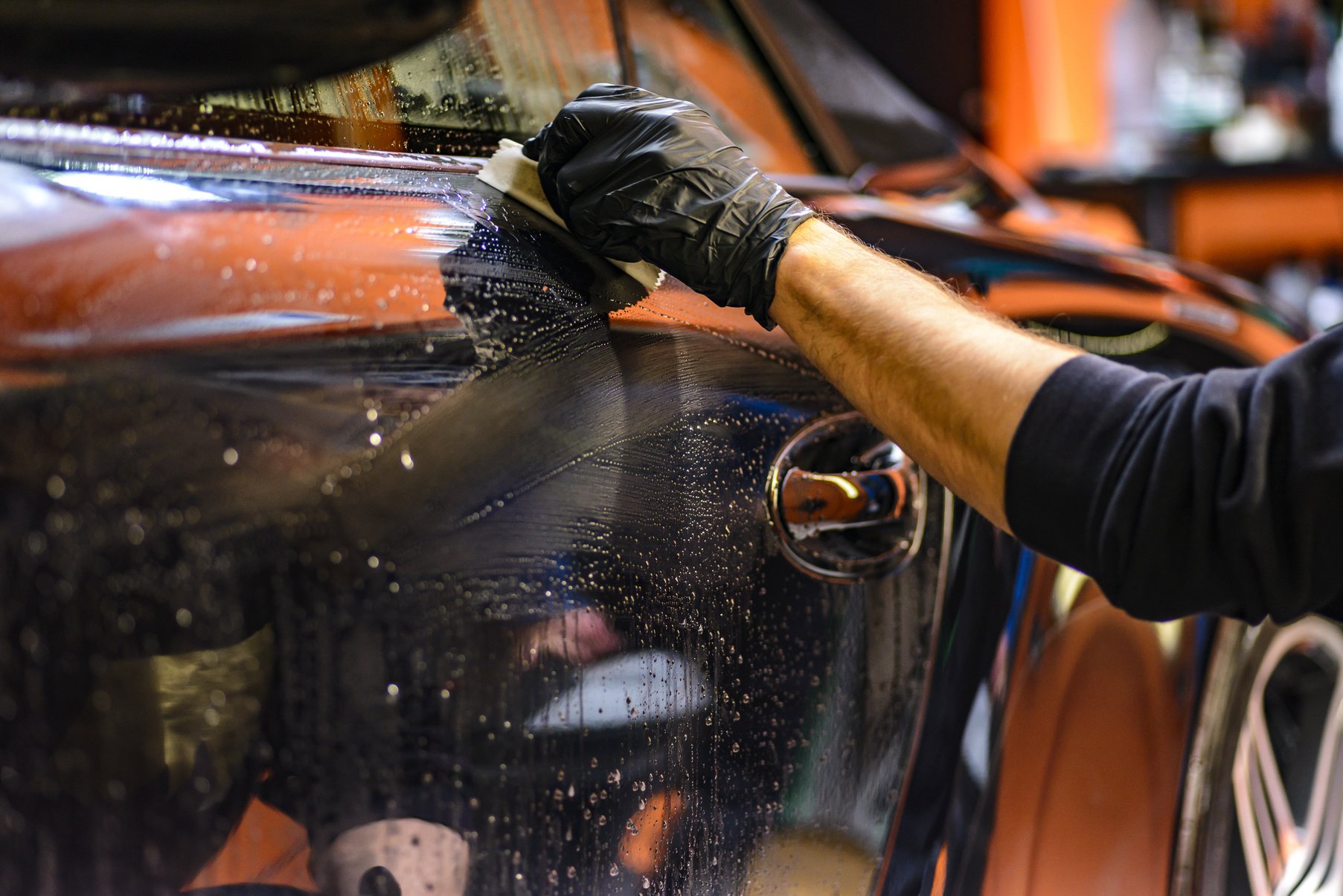 Washer Cleaning the Car